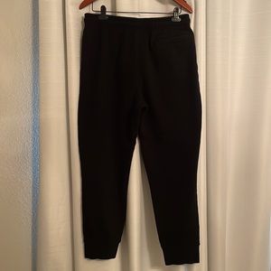 Reebok Sweats.  2 hand pockets, 1 back pocket and 1 side zipper pocket.